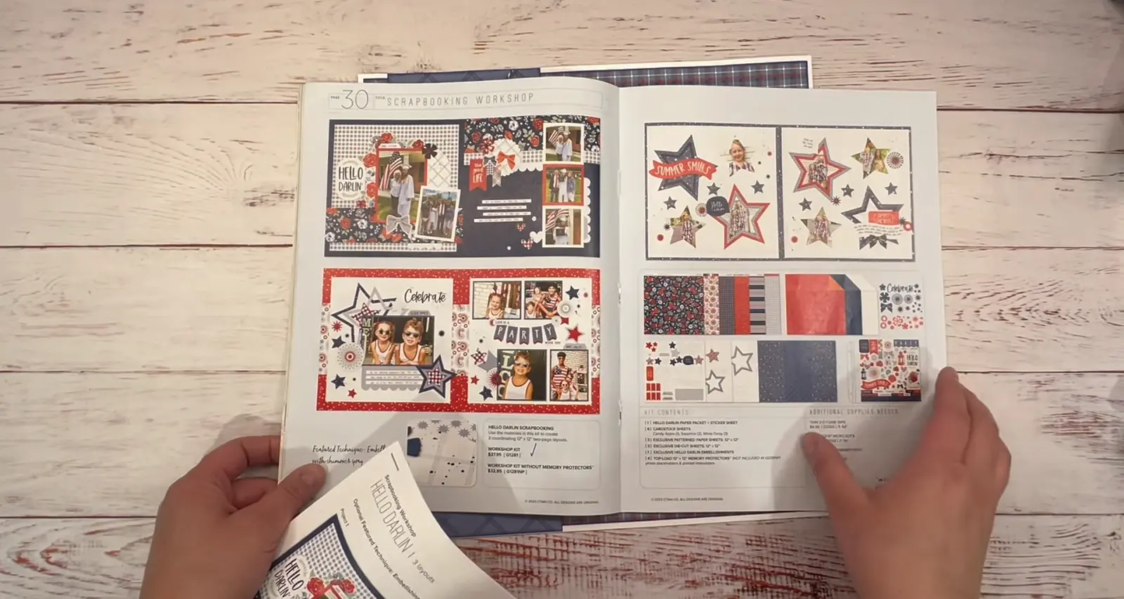 Scrapbook page with red, white, and blue designs, photo frames, stars, and stickers for decoration.