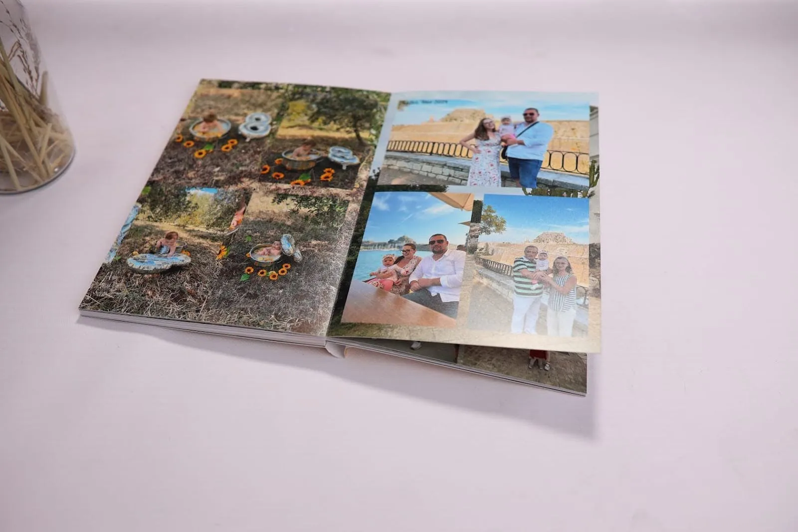 A Photo album at table with neatly arranged photos, captions, and decorative elements in a clean and organized layout.