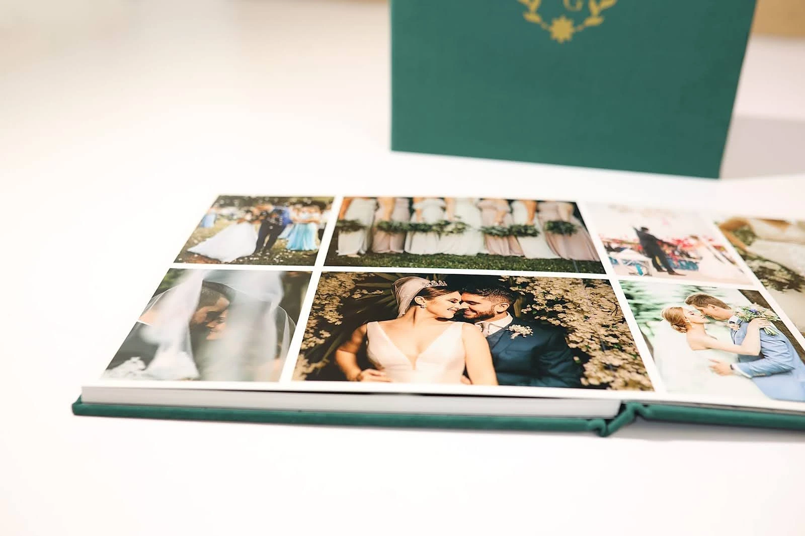 An open wedding photo album showing various romantic and candid moments of a bride and groom.